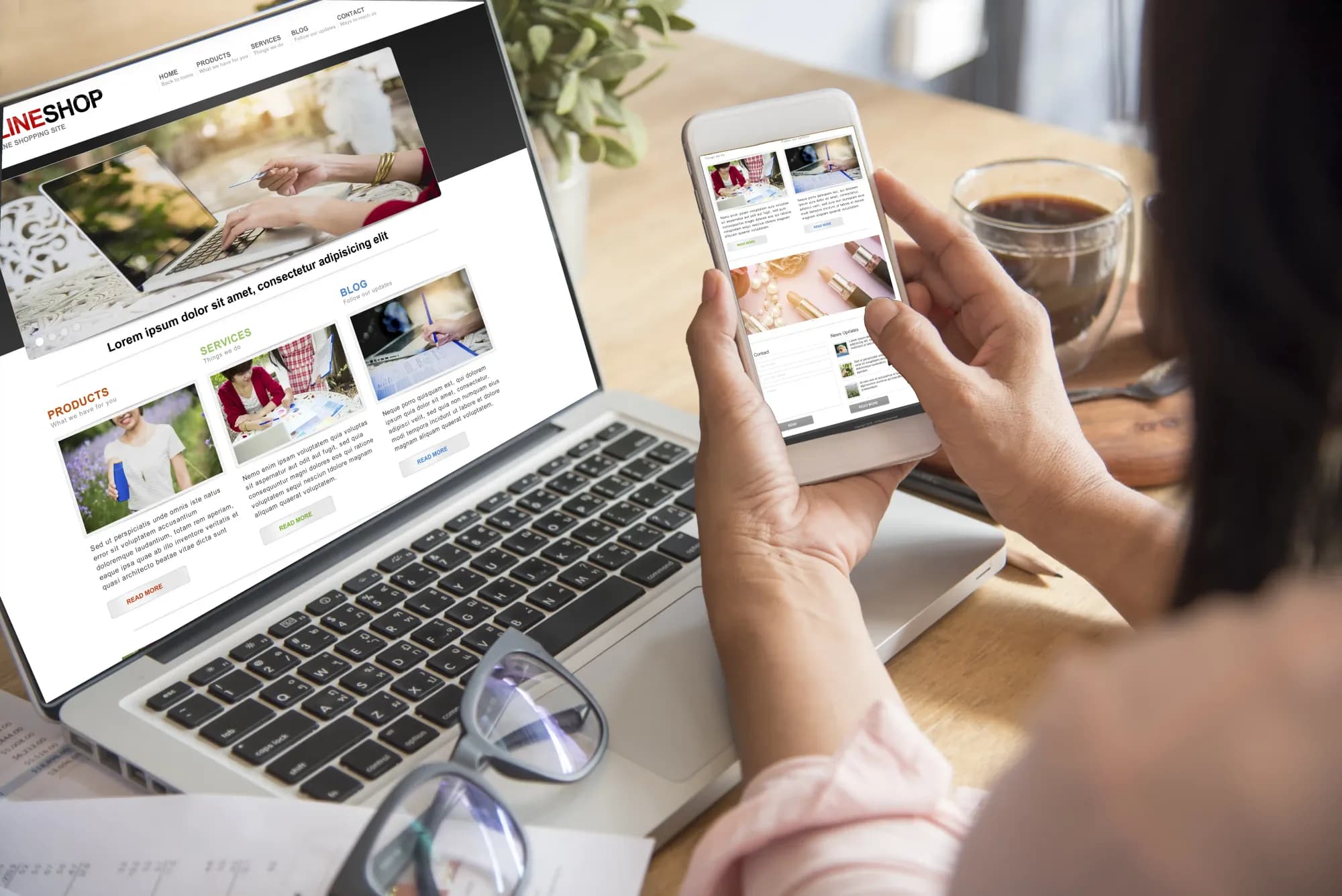 young-woman-using-smartphone-and-laptop-at-a-table